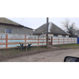 1/2 частина житлового будинку загальною площею 74.2 кв.м., за адресою: Полтавська обл., Глобинський р-н, с. Троїцьке (с. Фрунзівка), вул. Дружби (вул. Фрунзе), б. 7А